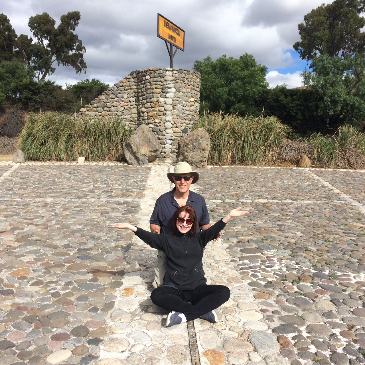 Murray Gottheil and Maureen McKay sitting on the equator.