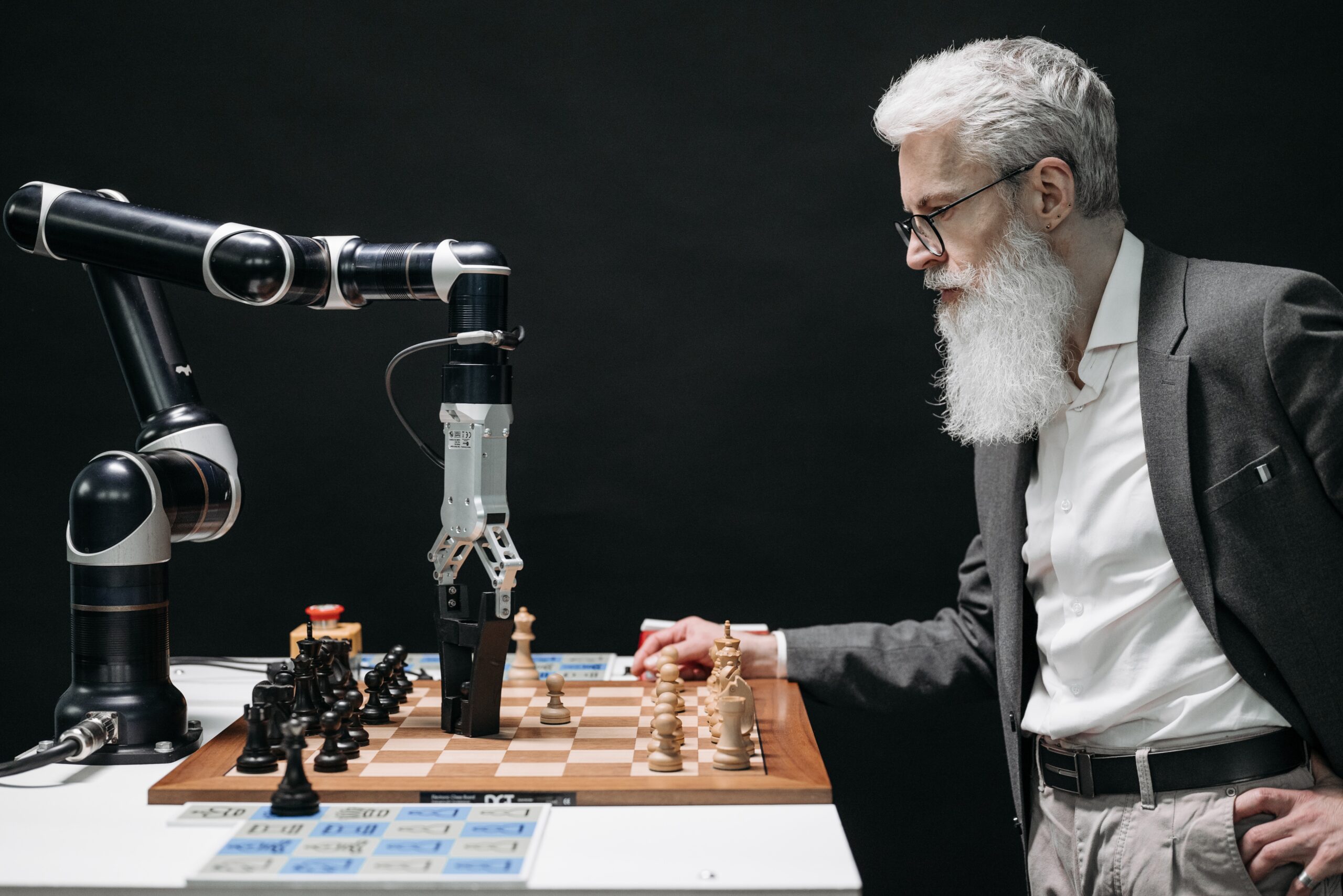 Man playing chess with a robot.