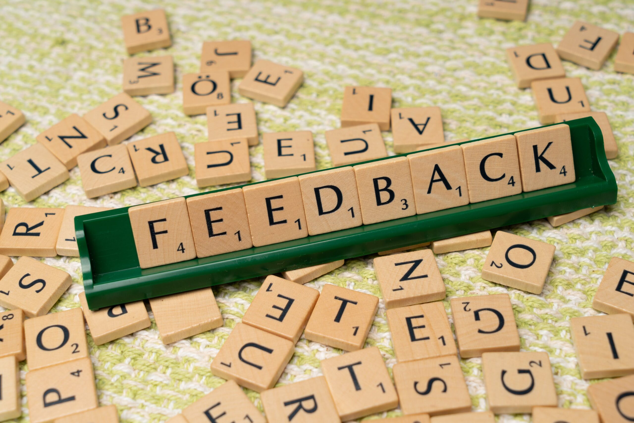 Feedback is spelled out in scrabble tiles.