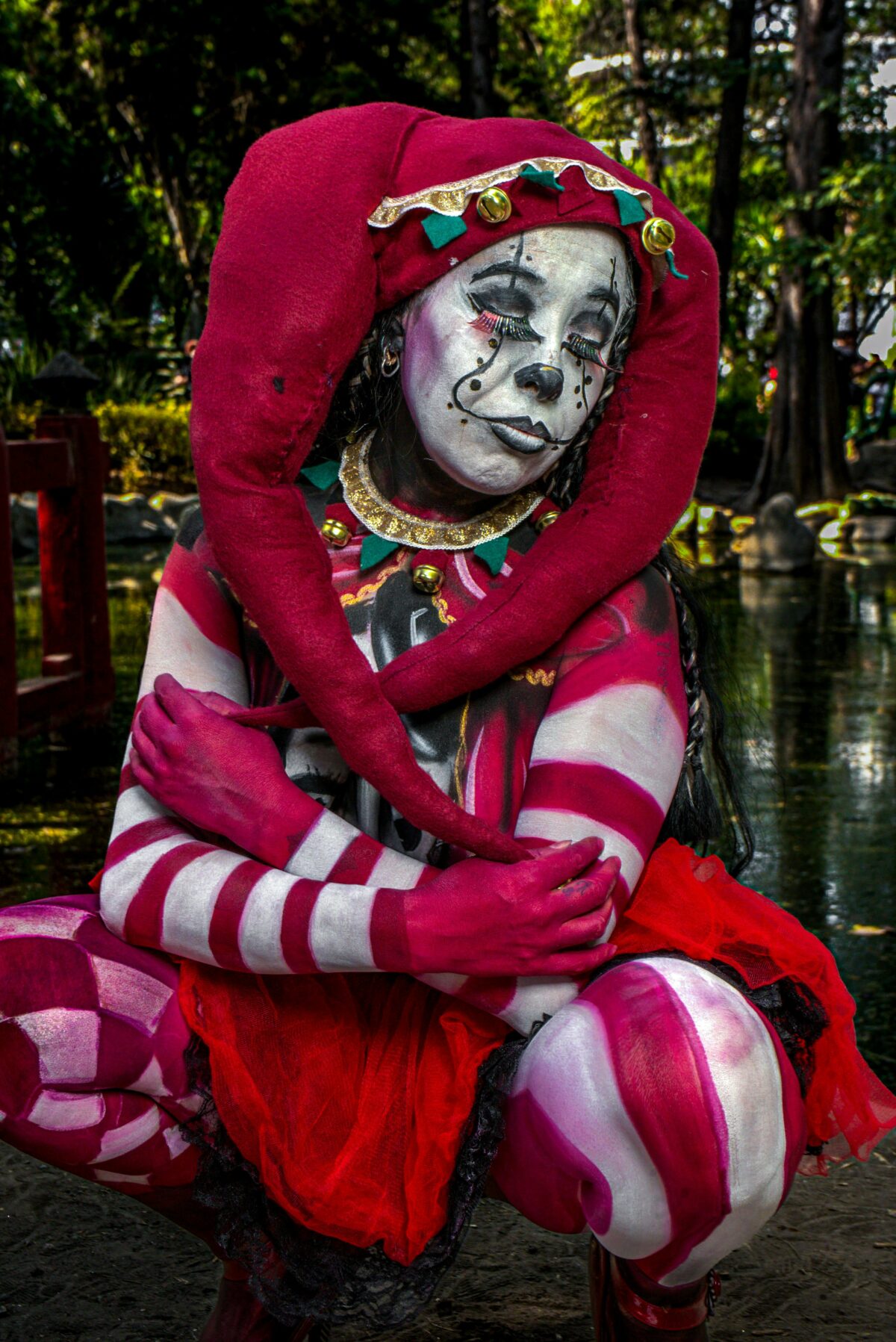 Woman in medieval fool costume.