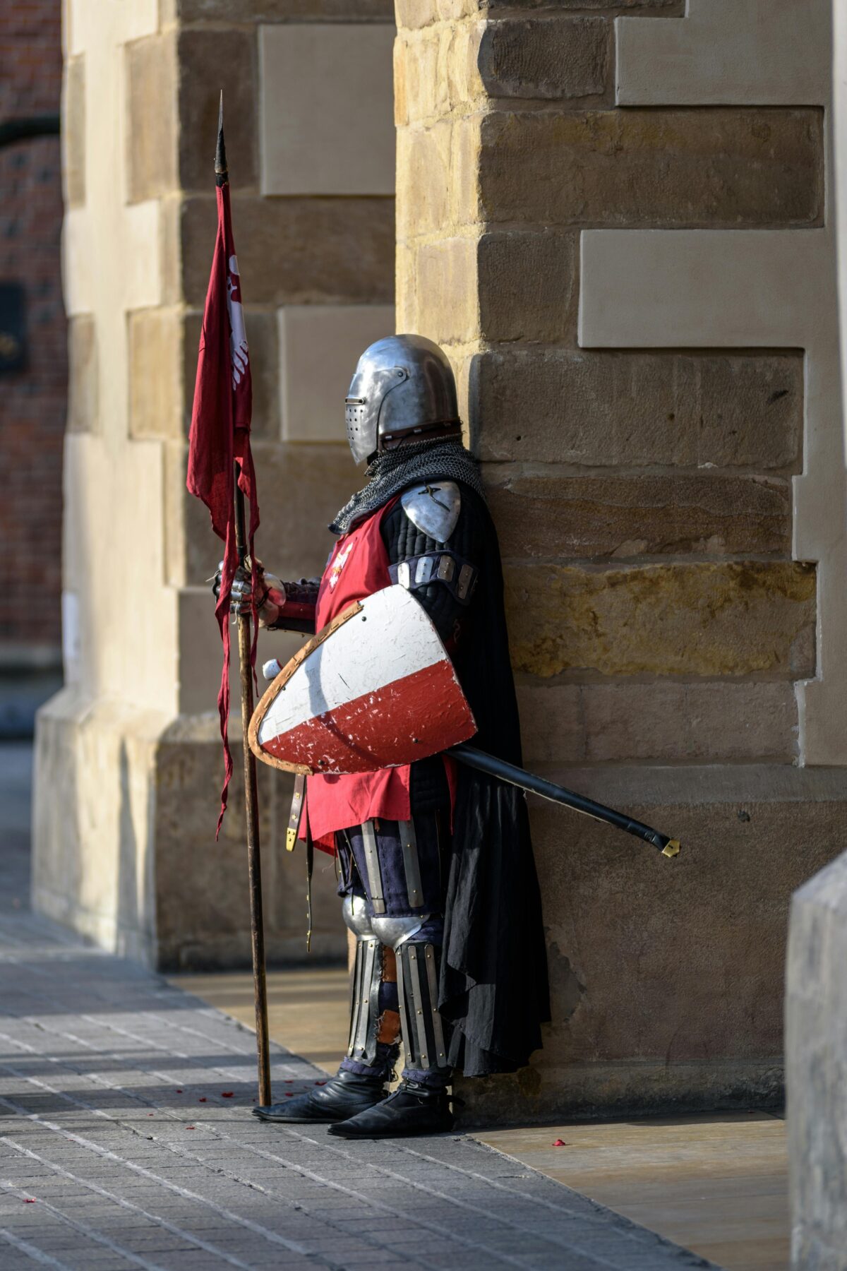 A knight in armour at a guard post.