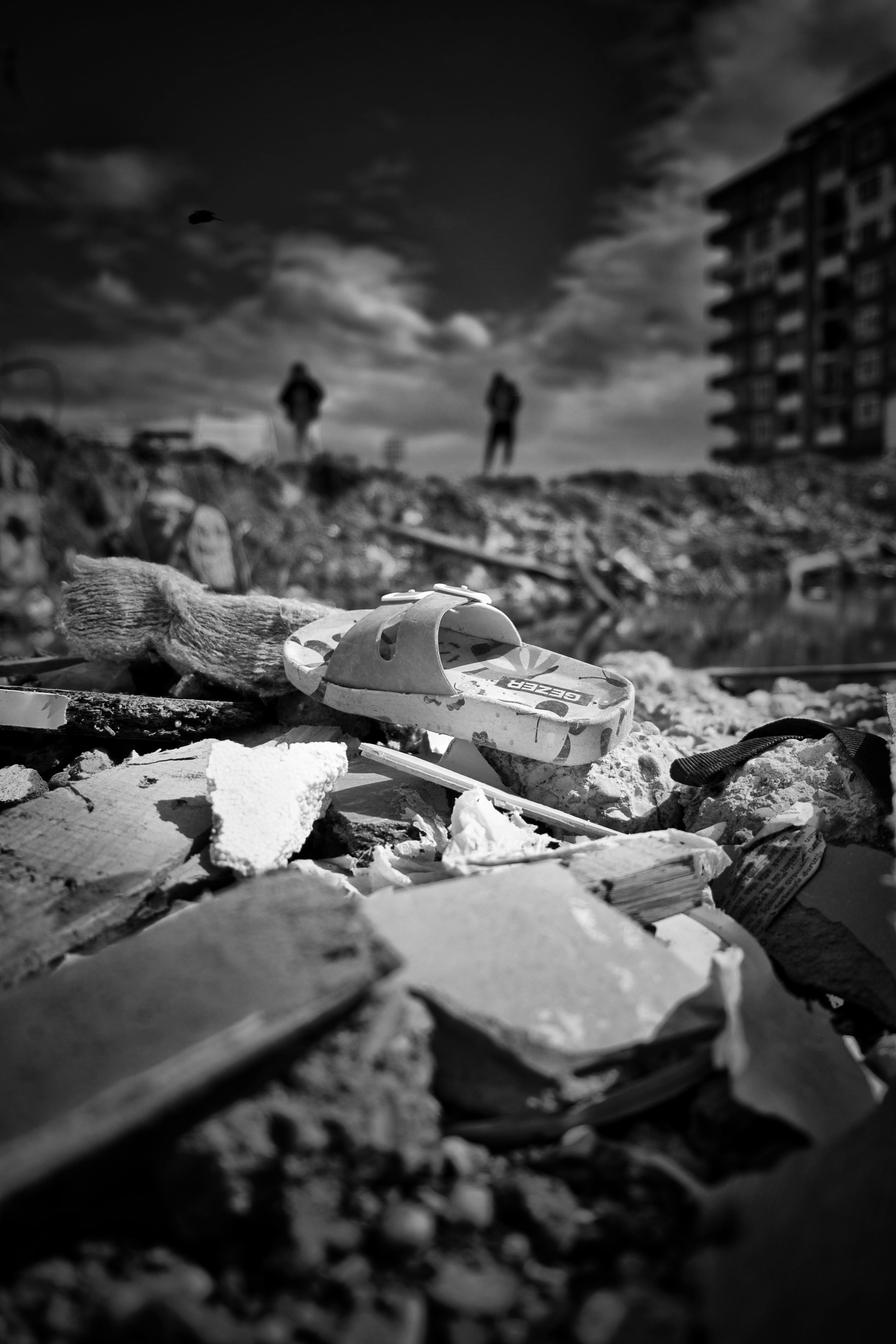 Black and white scene of damage and destruction.