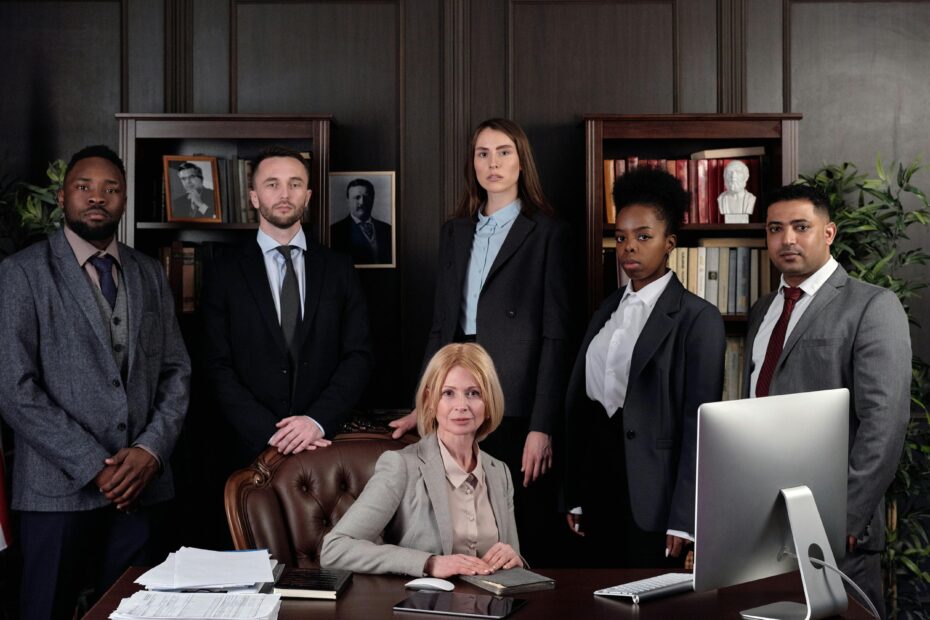 A group of professionals posting for a formal picture.